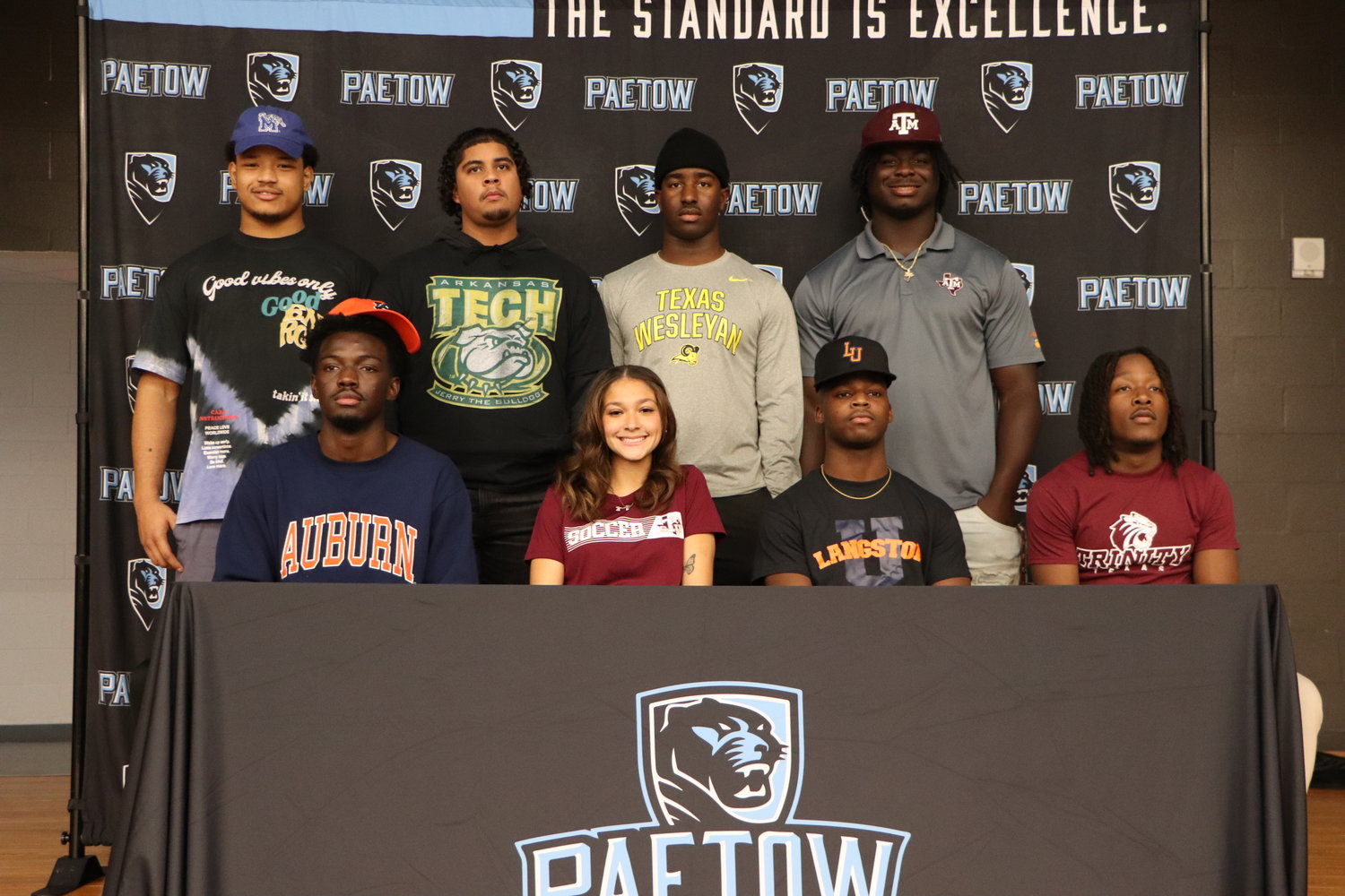Paetow student-athletes celebrate after signing a national letter of inter to play a sport in college.